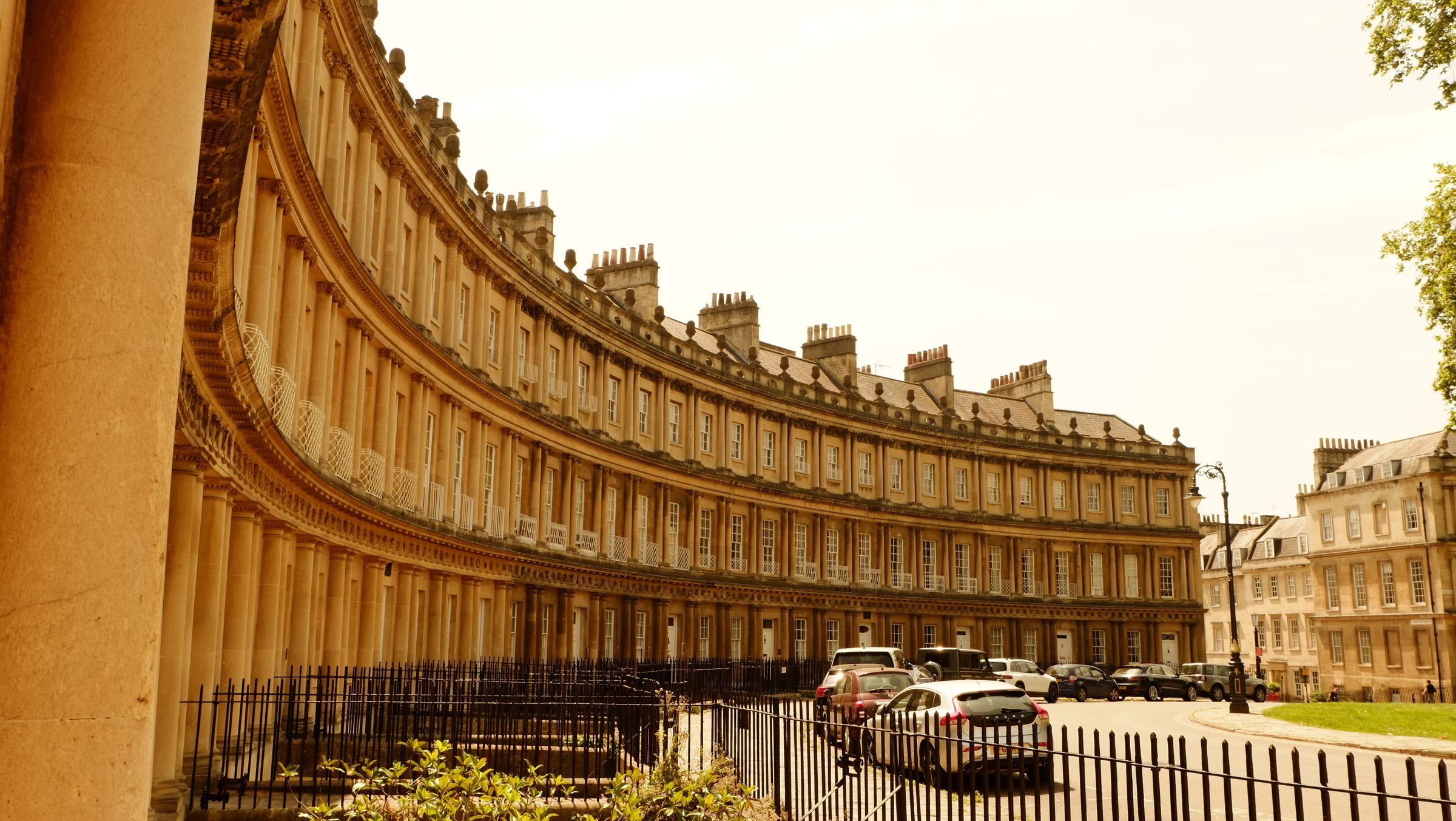 The curving, three-tiered columned terrace of the Circus sweeping round behind black iron railings
